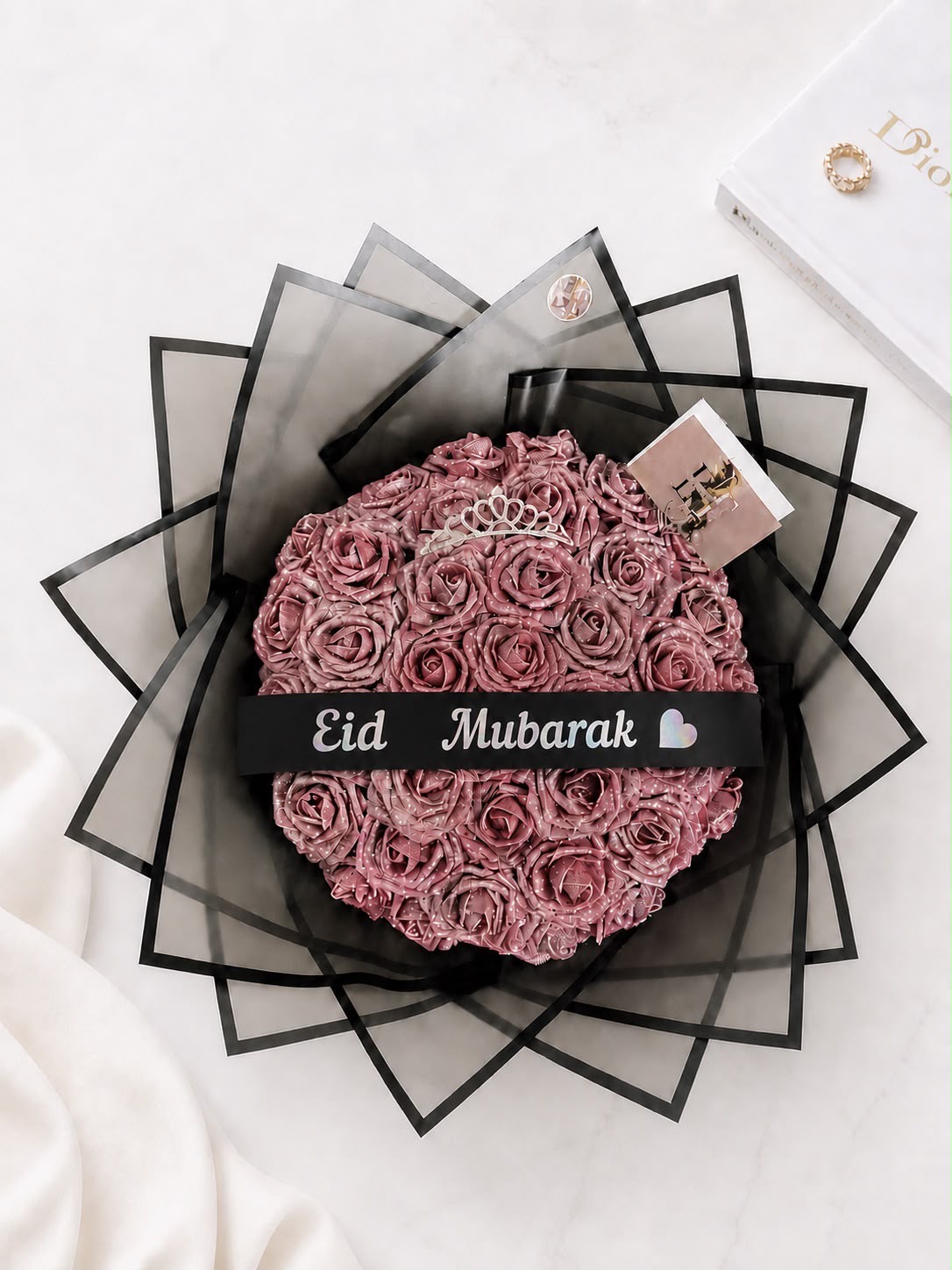 Pink rose arrangement with 'Eid Mubarak' ribbon and tiara accent